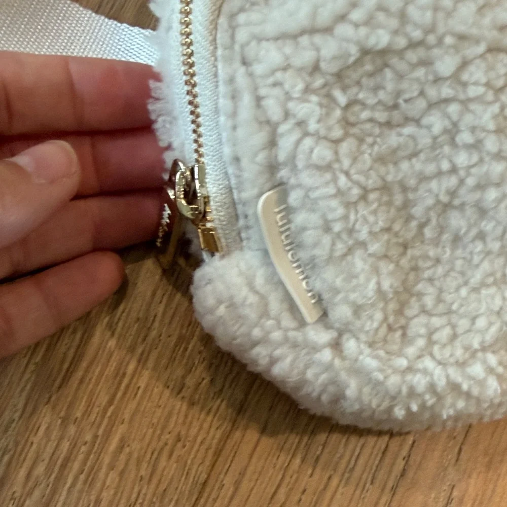 lululemon athletica Cream Sherpa Waist Bag with Gold Hardware
